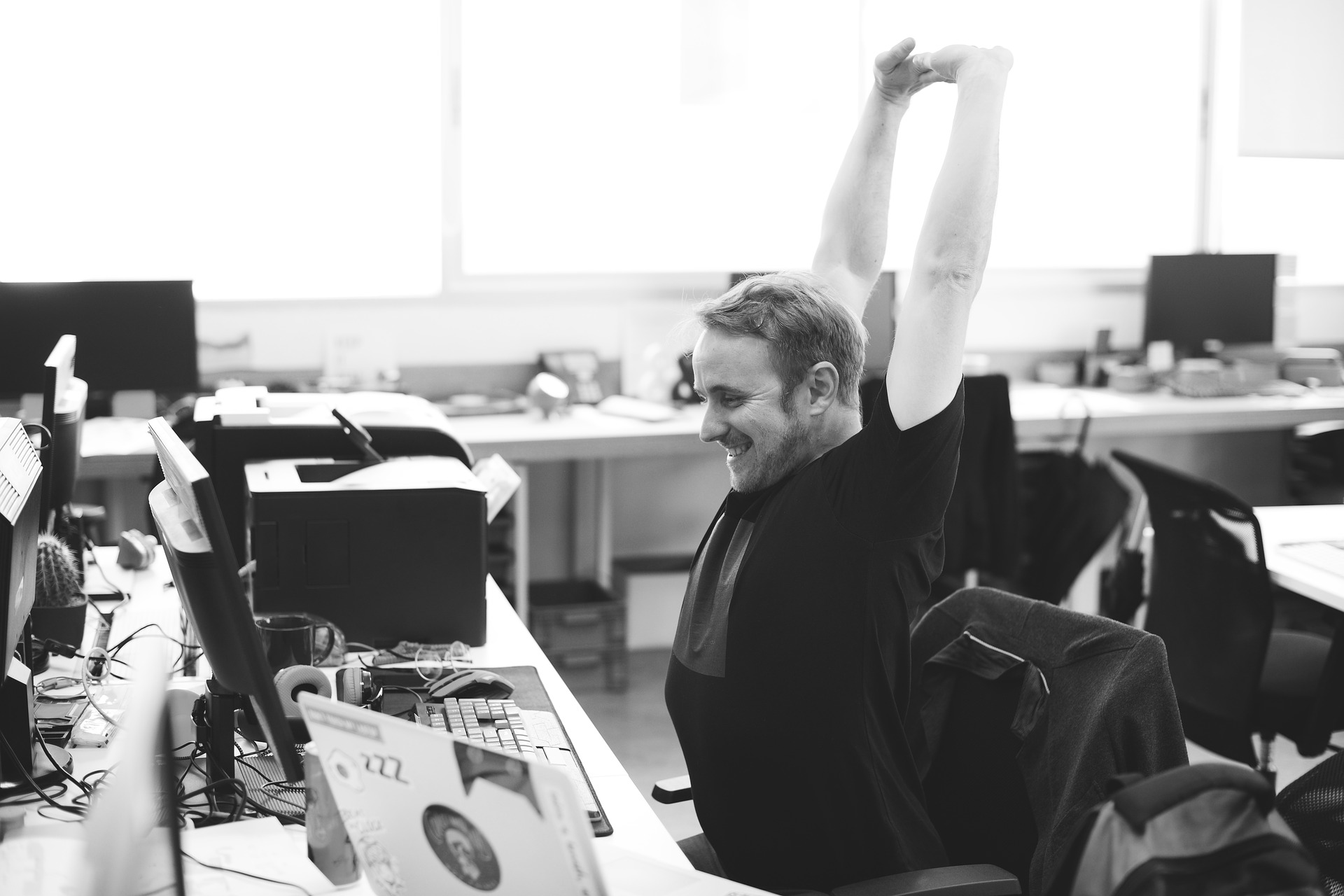 man stretching at workplace